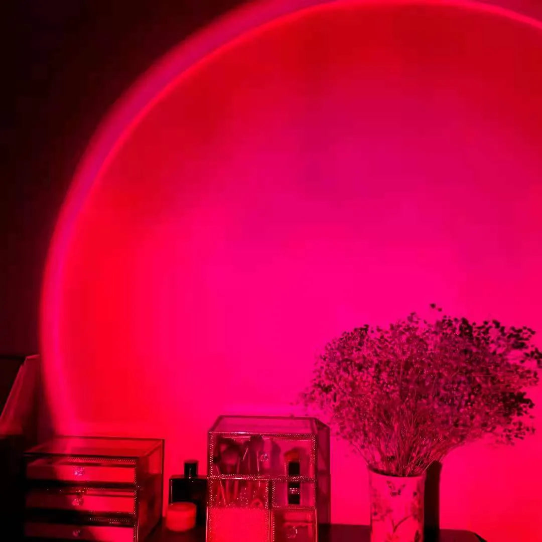 Rechargeable sunset red projection lamp with USB power connection and rainbow lighting effects