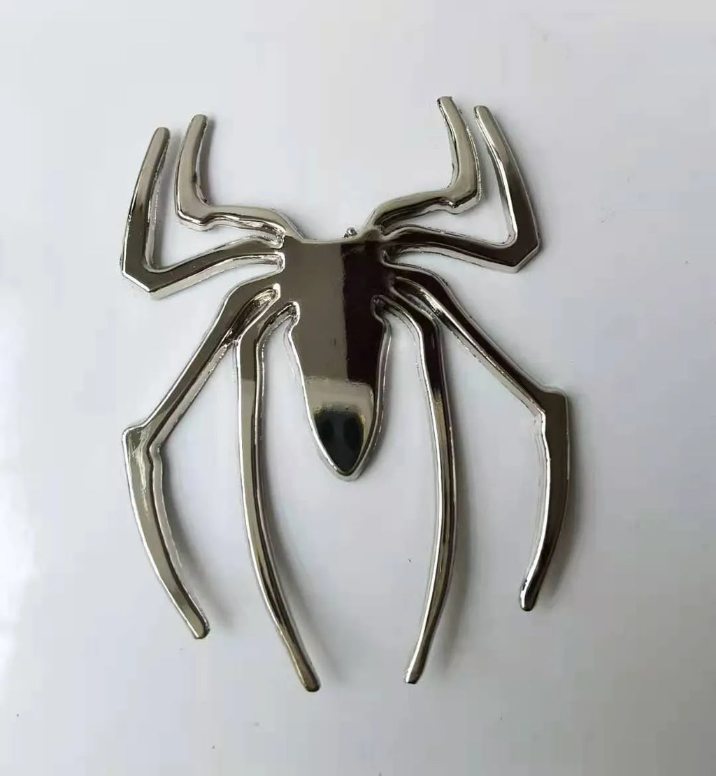 Three-dimensional metal spider bumper sticker in zinc alloy, showing detailed design