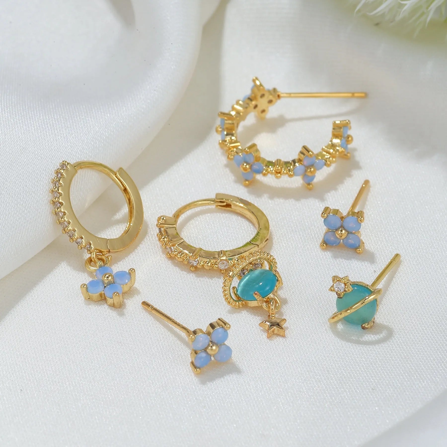 Gold and silver flower stud earrings with blue zircon mosaic accents in Japanese Korean style