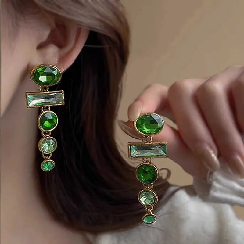 A pair of green gradient geometric drop earrings with alloy construction and inlaid zircon stones.