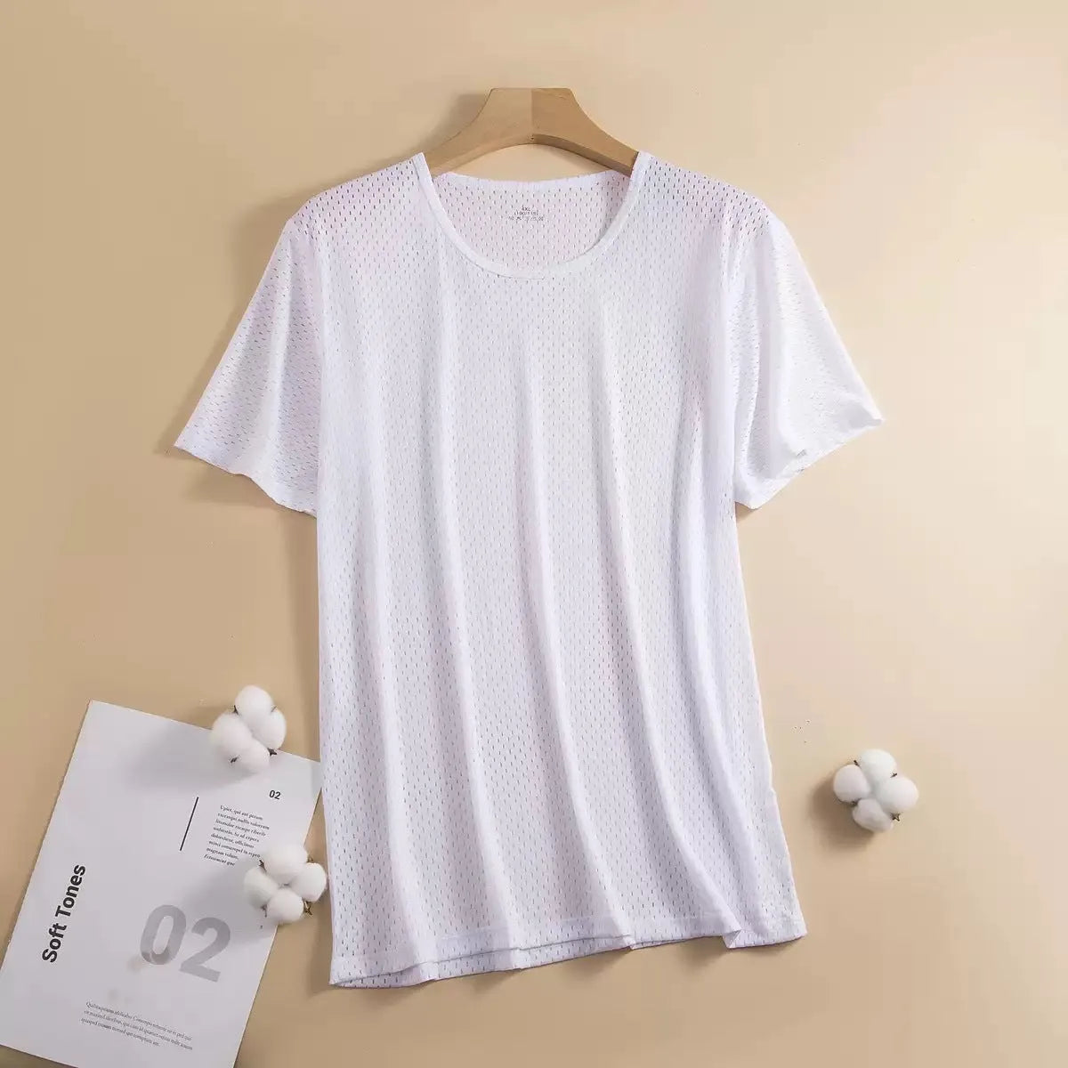 Man wearing a solid colour ice silk short sleeve crew neck T-shirt in a loose fit.
