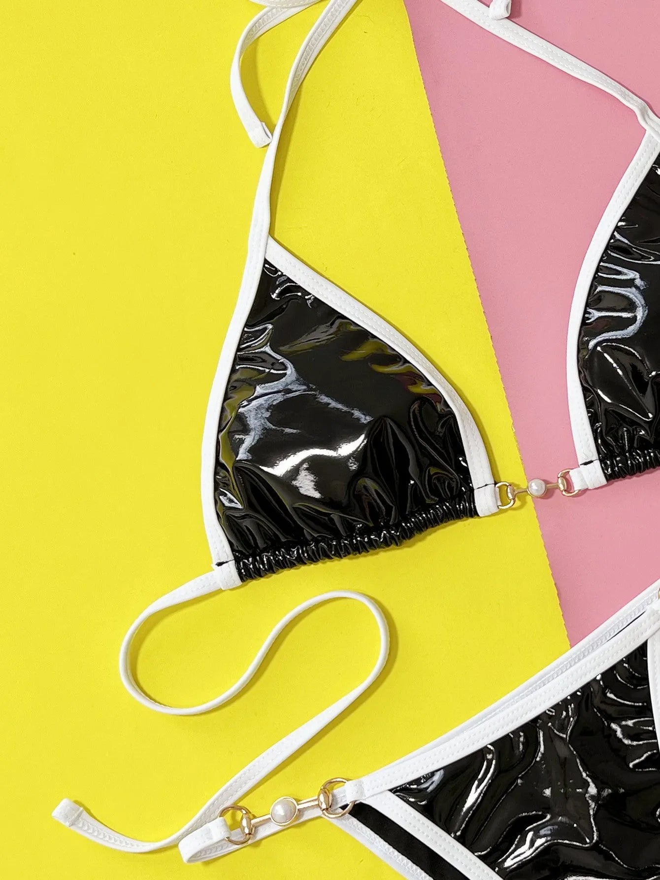 Women's black split bikini swimsuit with solid colour design for swimming