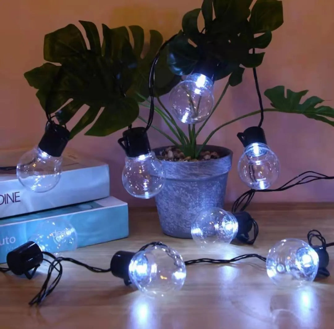 Solar-powered retro decorative string lights for festival tents with black wiring and LED lamps