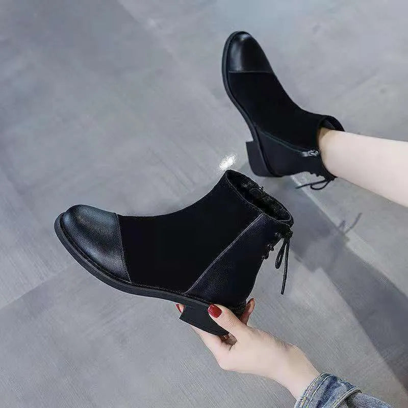 Women's black knee-high Martin boots with side zip and bow detail