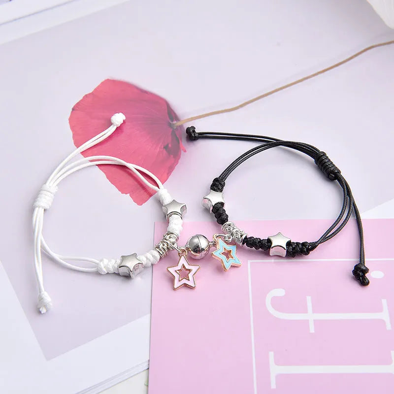 Magnetic couple bracelet pair with alloy electroplating in various designs including clover and crown patterns