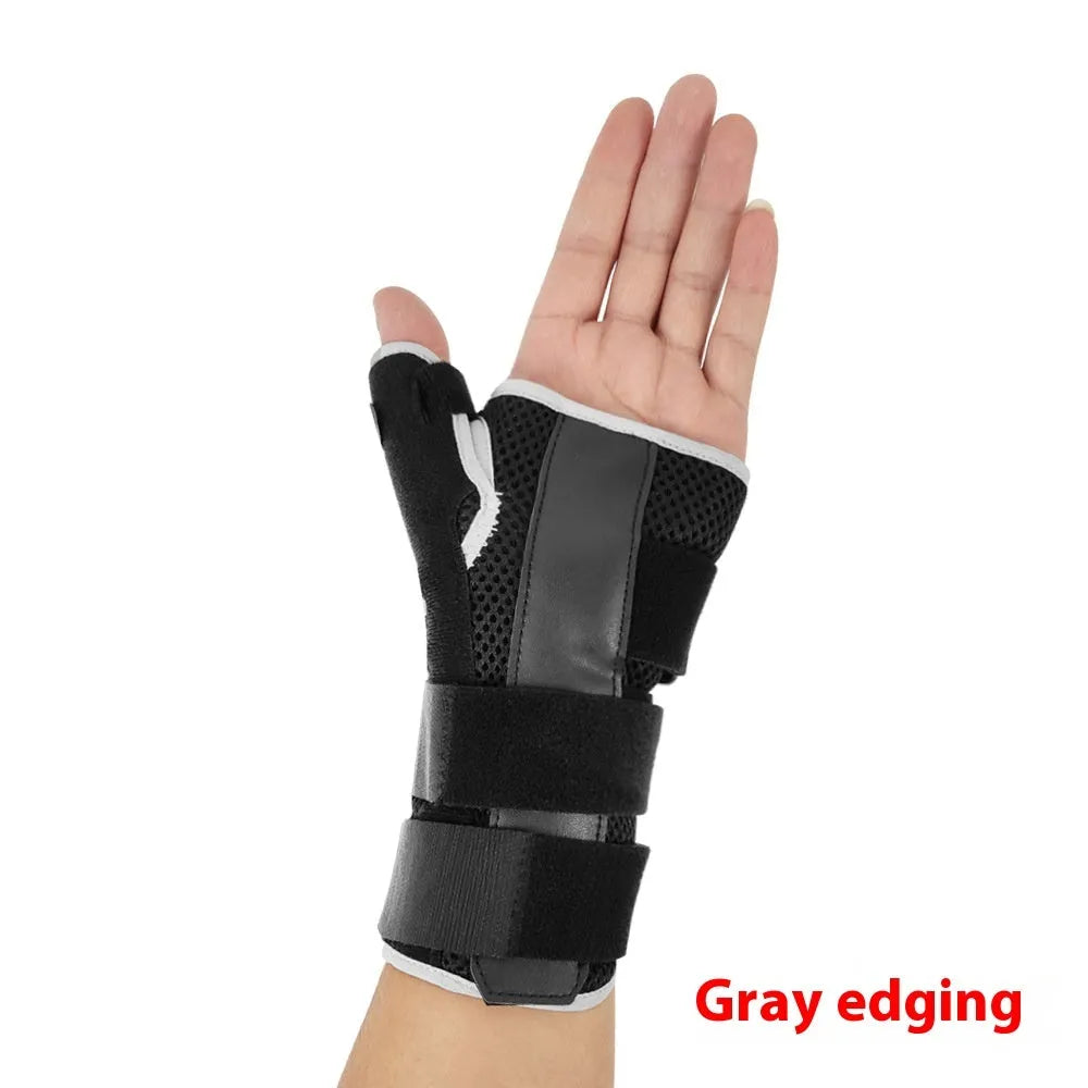 Black carbon fibre pattern wrist guard with grey edging and a thumb strap.