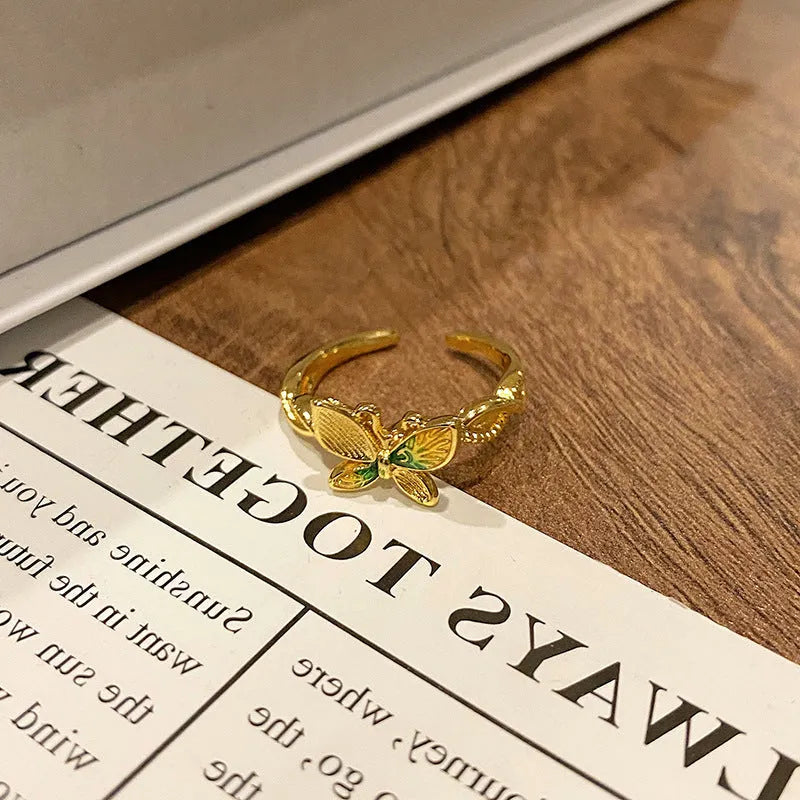 Copper Chinese butterfly women's ring showing creative design with oil dripping treatment finish