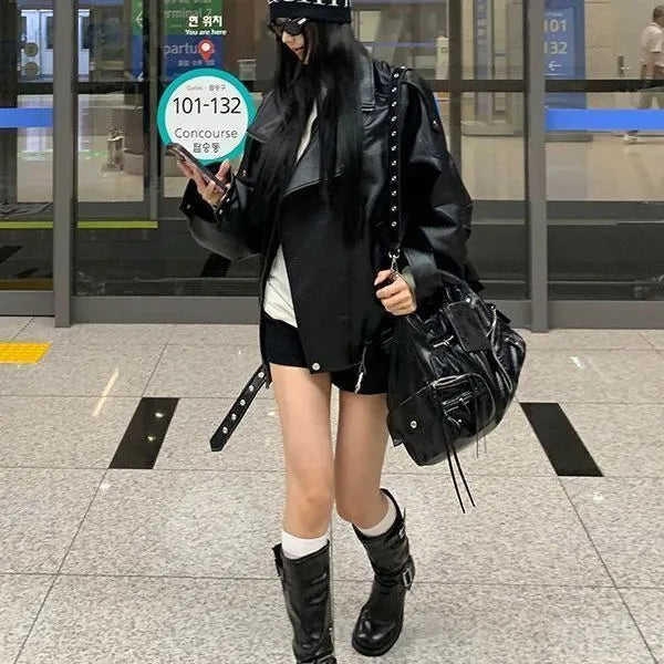 Women's loose retro biker jacket in faux leather, available in brown and black, long sleeves, splicing detail, no fur collar
