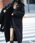 Long grey knitted cardigan with hood showing 80cm length and loose fit design
