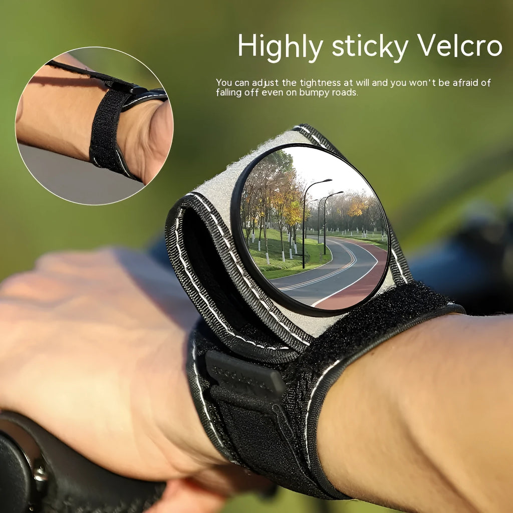 Black nylon wrist-mounted rear-view mirror for bicycles on a cyclist's wrist.