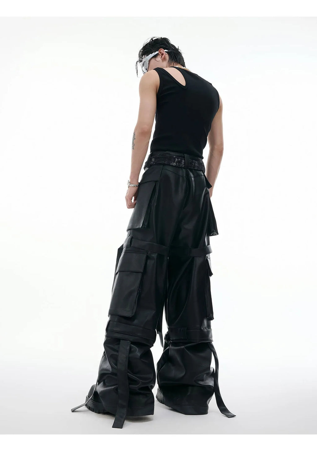 Black loose-fit retro leather pants with multiple pockets and quilted stitching detail