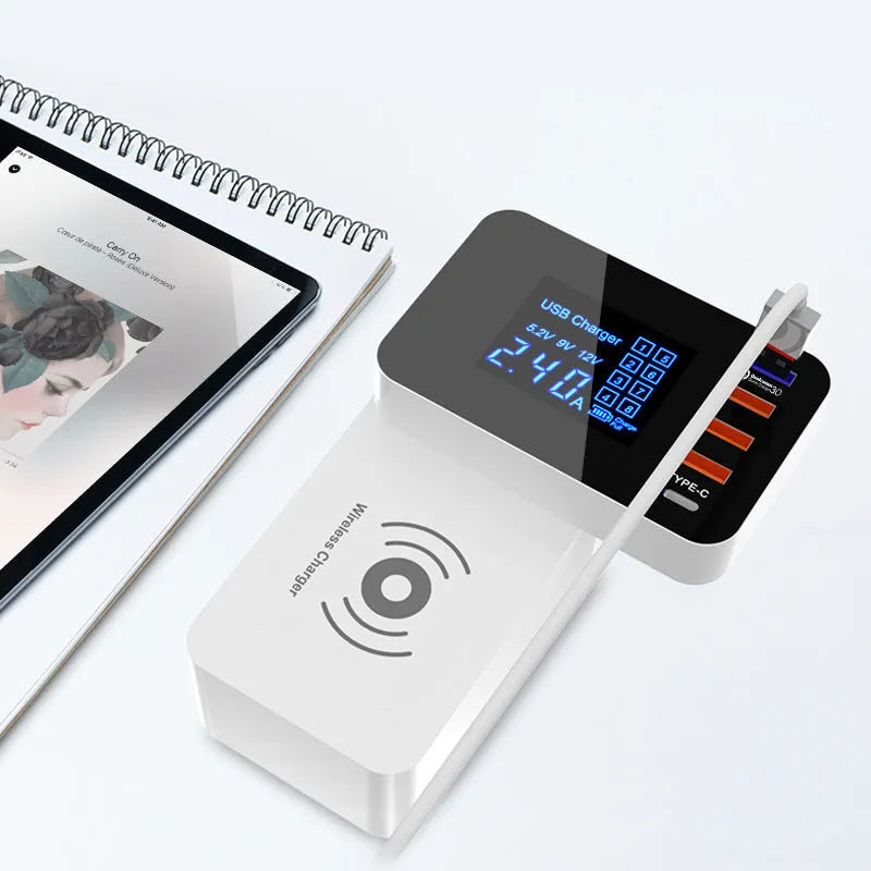 White multi USB port fast charger with wireless charging pad on top, showing four USB ports and UK plug adapter