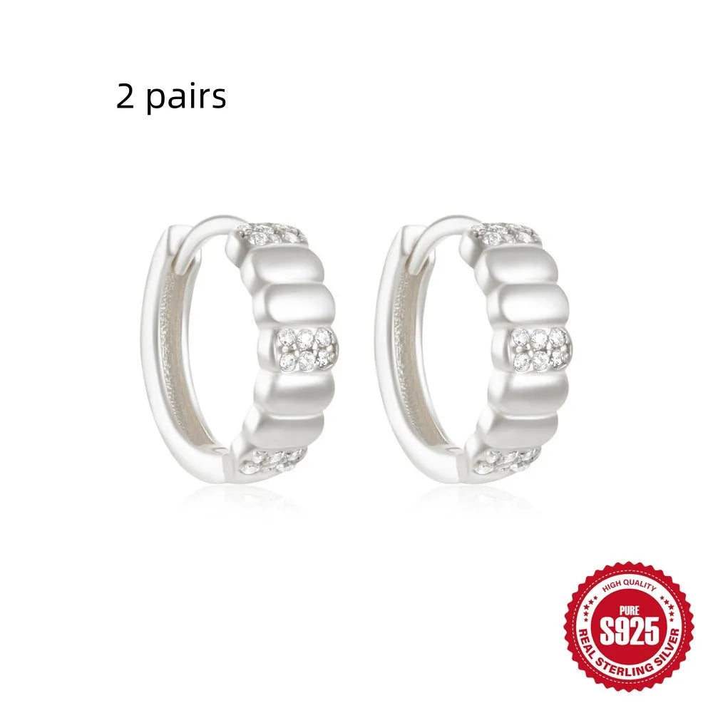 Sterling silver geometric stud earrings with small round diamond accents in gold or silver electroplated finish