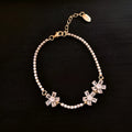 Gold-coloured copper women's bracelet with geometric quadrilateral design and inlaid zircon stones