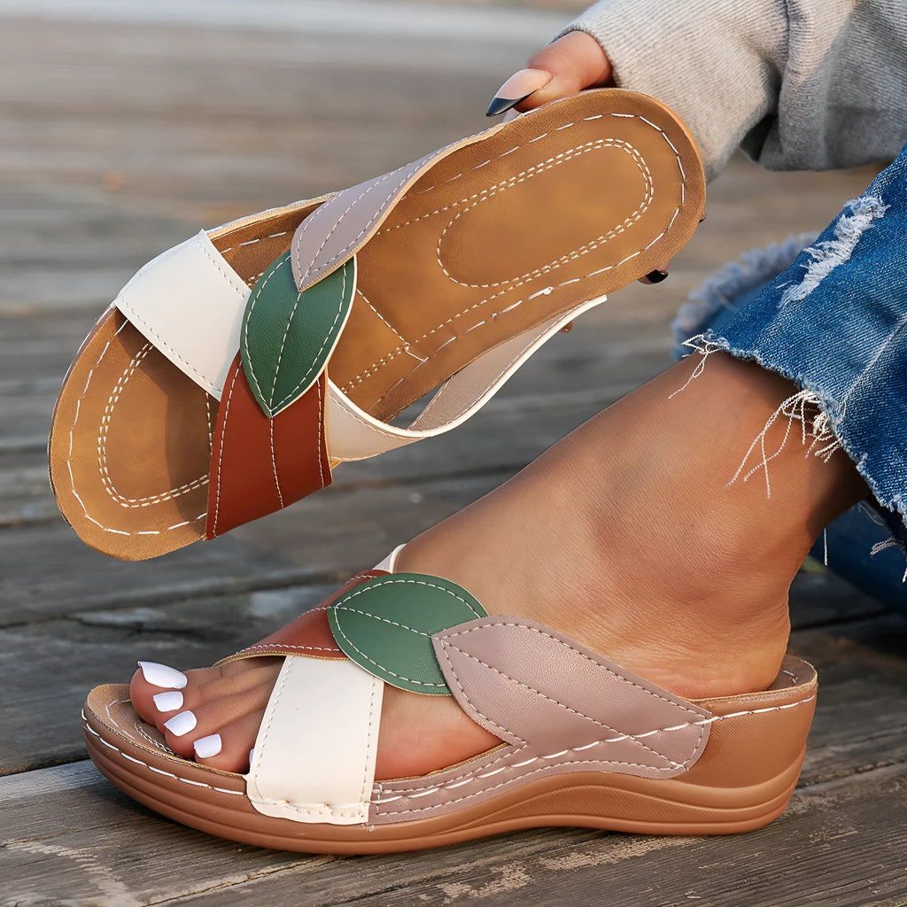 Women's black thick-soled slippers with cross-straps and a peep-toe