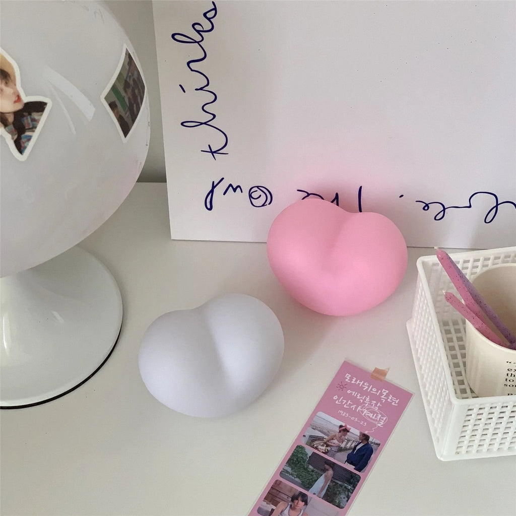 White or pink vinyl atmosphere lamp in trumpet or tuba design with warm glowing light