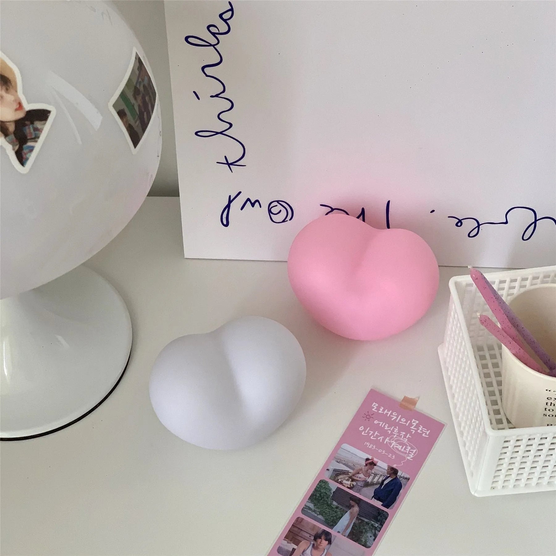 White or pink vinyl atmosphere lamp in trumpet or tuba design with warm glowing light