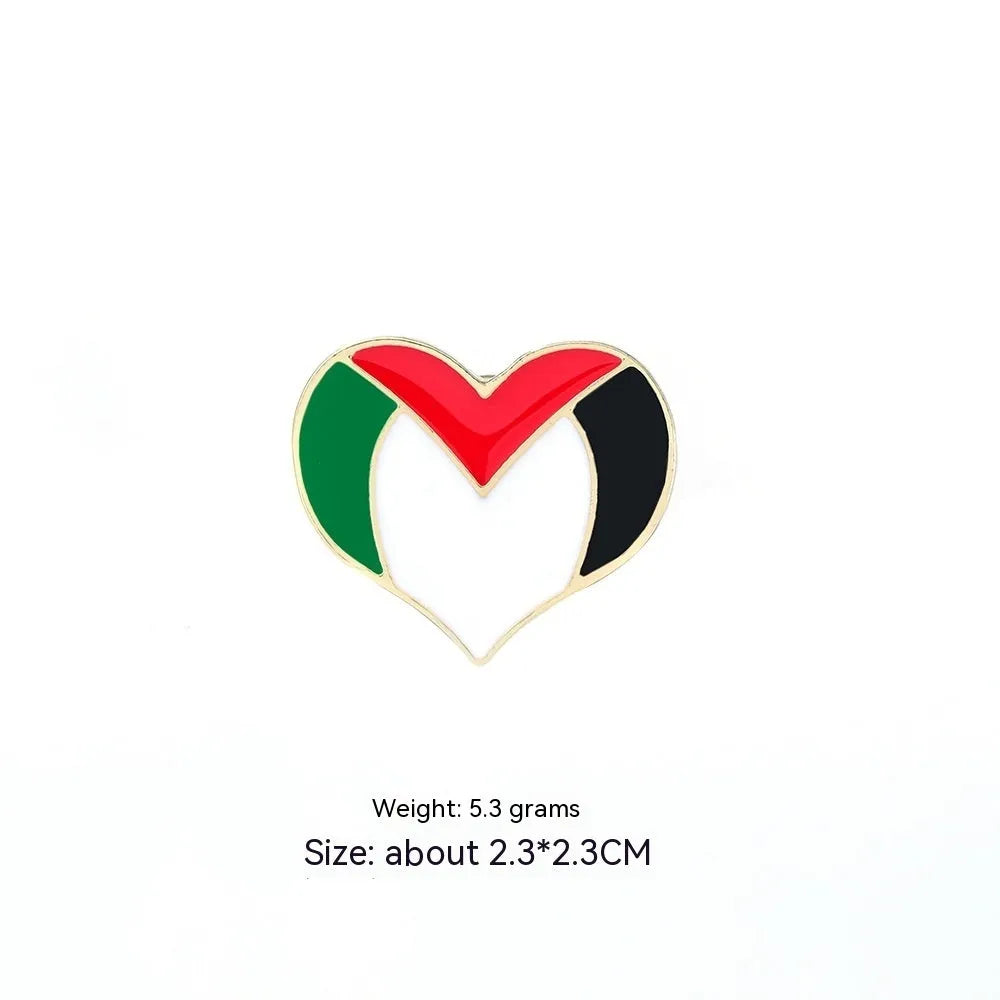 Square corrugated alloy brooch with Palestinian flag design on a neutral background