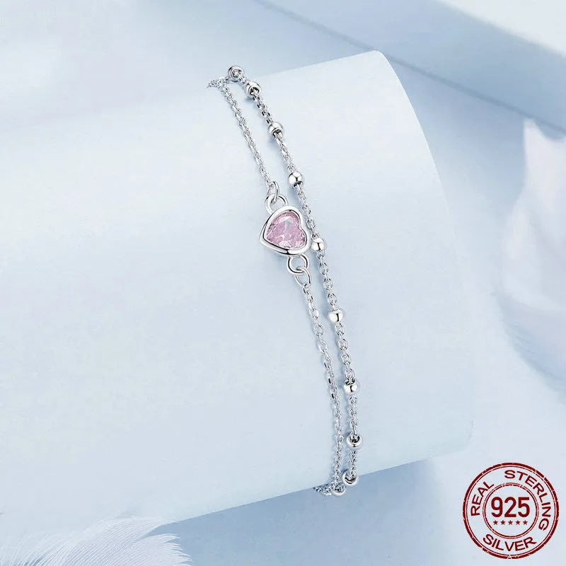 Women's sweet style 925 sterling silver bracelet with a small heart pendant on an adjustable chain.