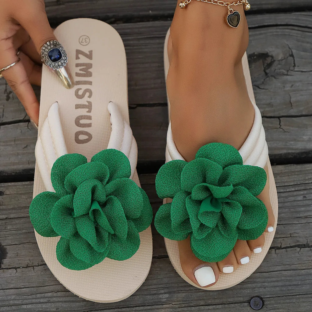 Plus size floral slipper in solid colour with round toe and flip flop style.