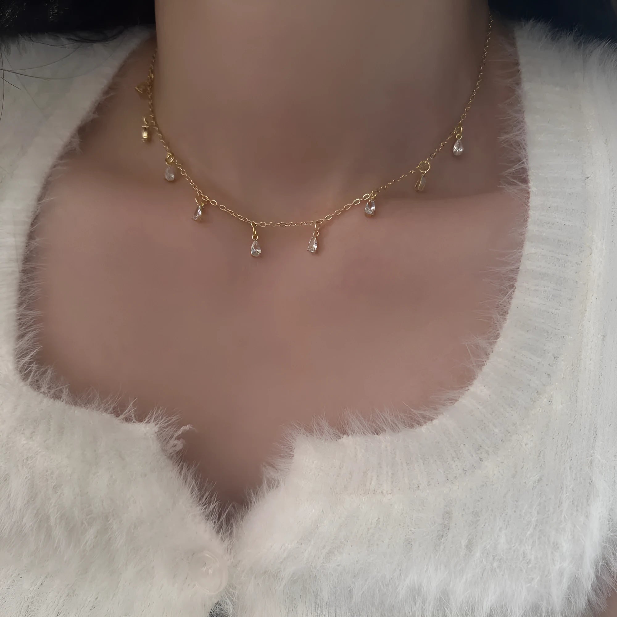 Women's zircon jewellery set showing geometric pendant necklace, matching earrings, and anklet with meteor shower design