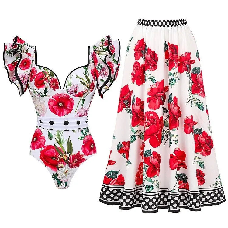 Adult woman modelling a printed one-piece swimsuit in a choice of colours including rose pink, blue, white, and a red apron set style.