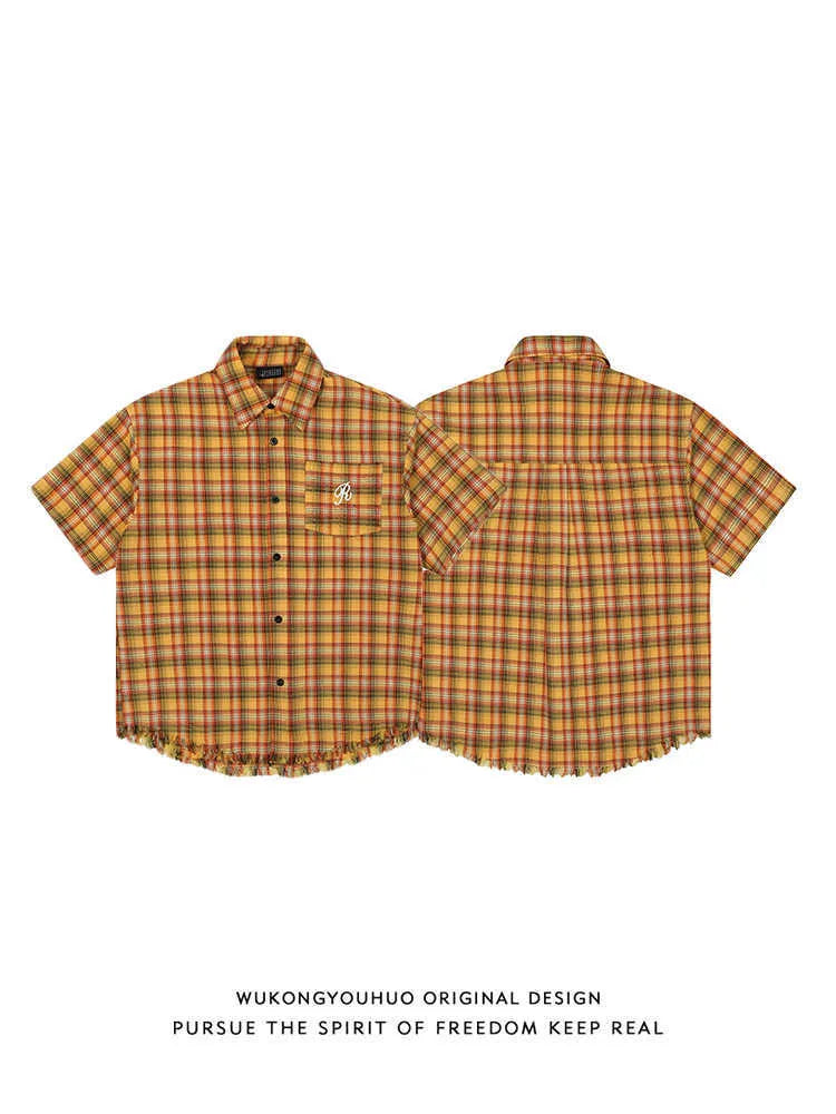 Yellow plaid short sleeve shirt with embroidery pocket detail on front