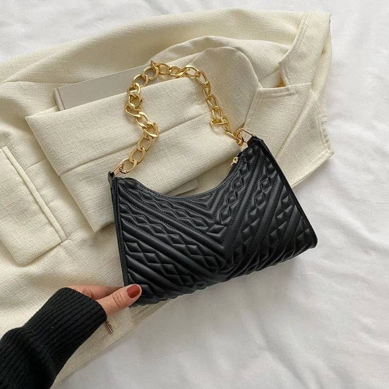 Brown pleated chain shoulder bag showing vertical square shape and adjustable strap