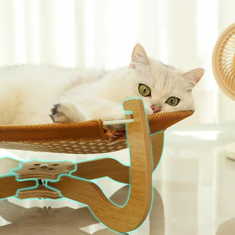 Brown square woven rattan pet hammock bed for cats and small dogs on a wooden floor.