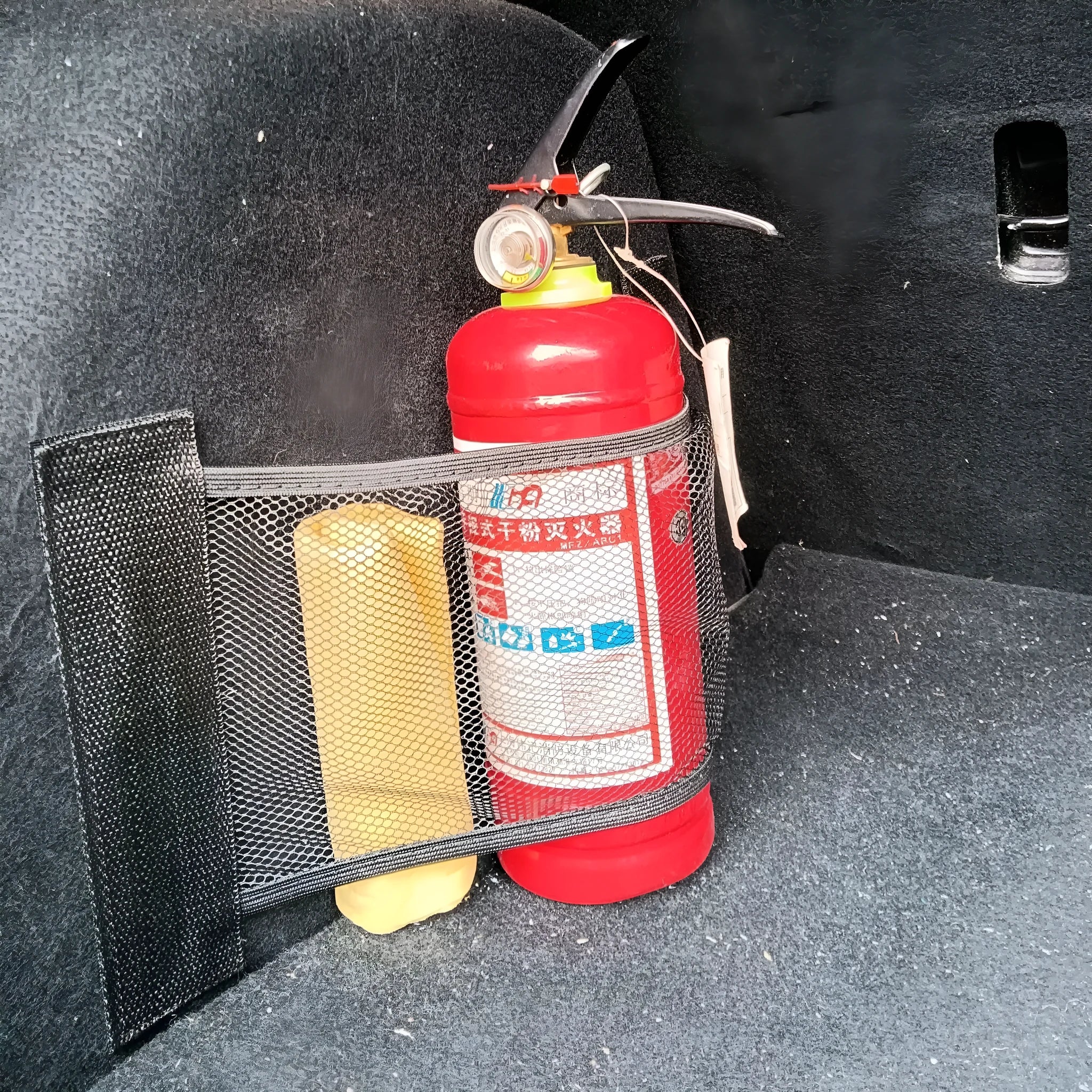 Black elastic polyester storage net for securing items in a car boot, shown in 20x35cm and 20x45cm sizes.