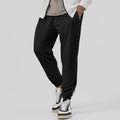 Men's gray elastic track sweatpants with straight-leg tapered design and mid waist