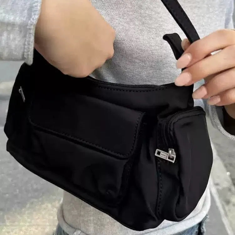 Black lightweight women's shoulder bag with double pockets and a side line design.