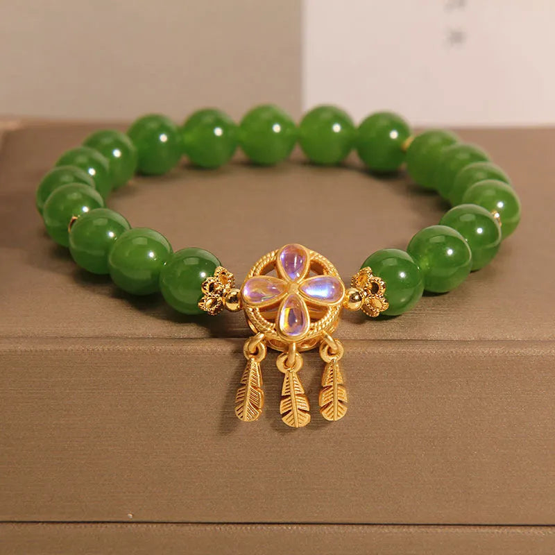 Green jasper bracelet for women with a crystal four-leaf clover dream catcher pendant.