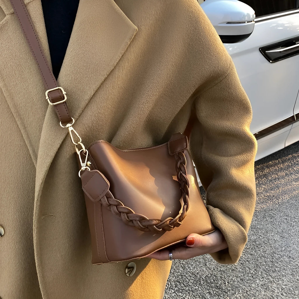 Retro woven PU bucket bag in khaki colour shown as crossbody and underarm bag