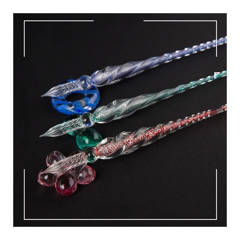 Transparent glass art pen with coloured ink dipped design in a gift box.