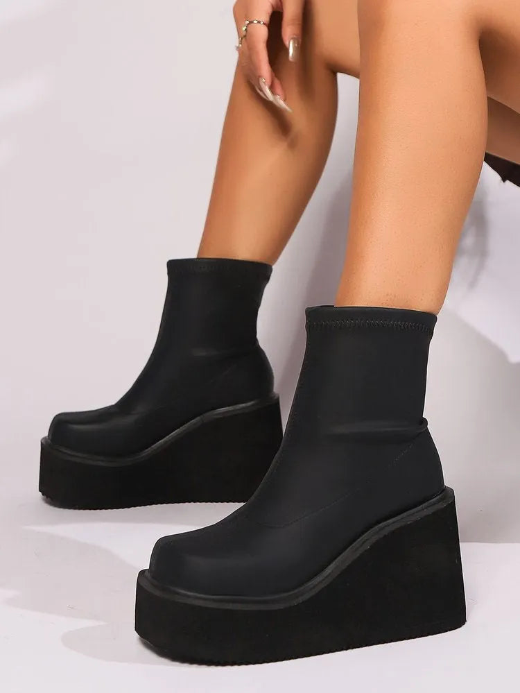 Plus size women's wedge heel boots with waterproof platform sole and round toe design