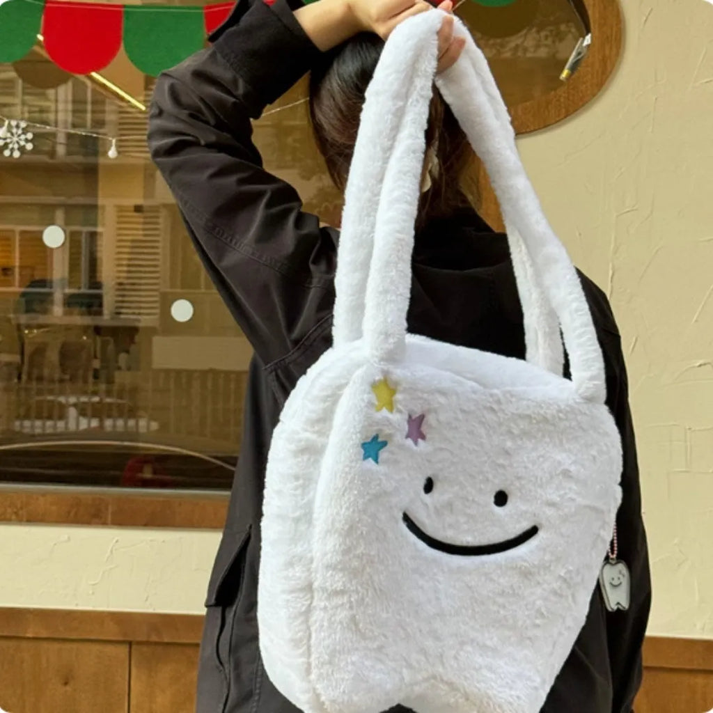 White plush shoulder tote bag with cute tooth design and zipper closure