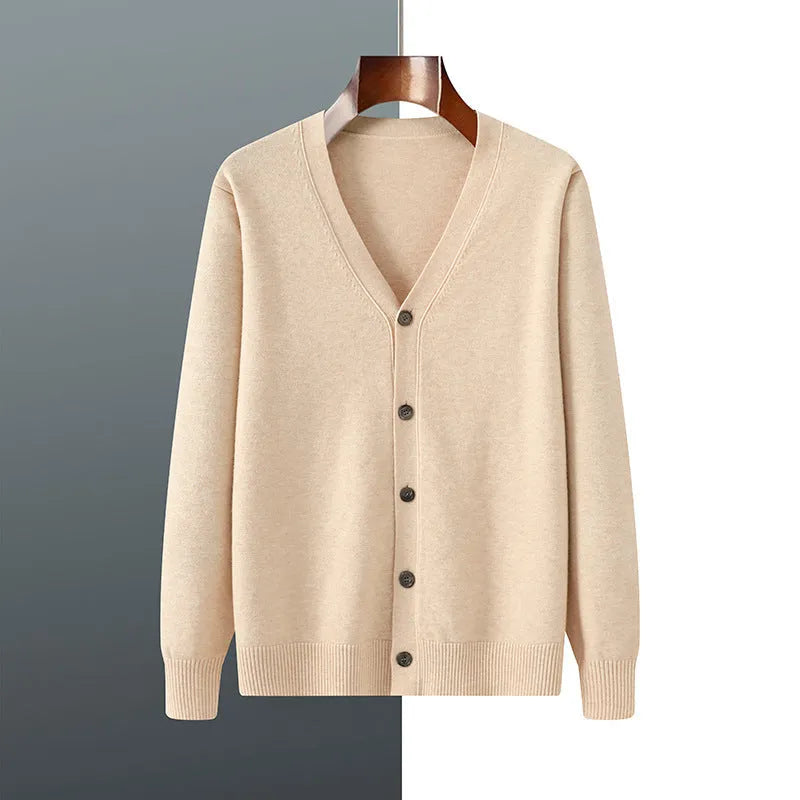 Man wearing a loose V-neck cardigan coat in Andy Velvet fabric, showing the long sleeves and available colour options.