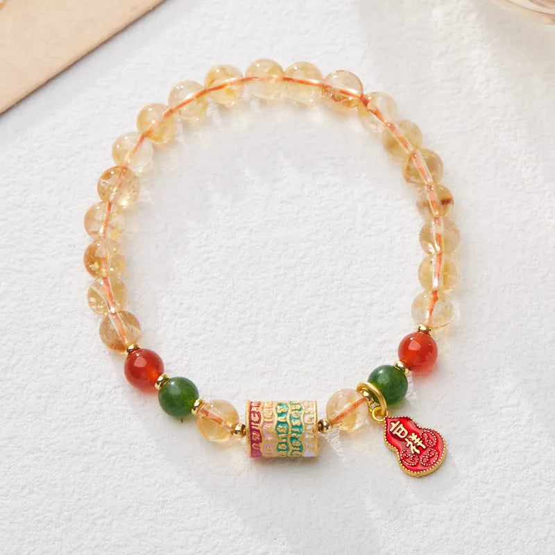 Hand-woven citrine five sutra bracelet with 6mm crystal beads on wrist