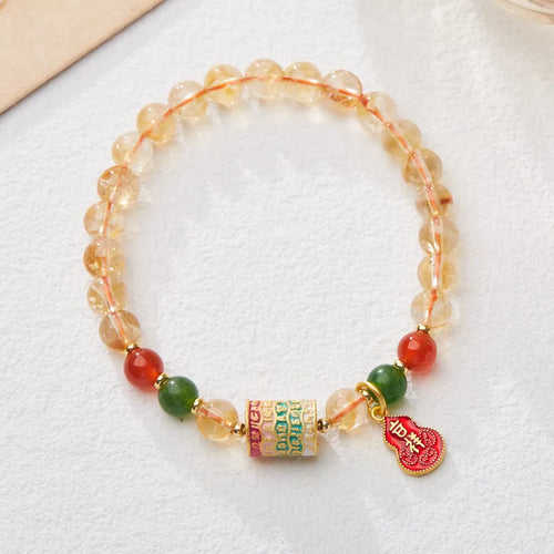 Hand-woven citrine five sutra bracelet with 6mm crystal beads on wrist