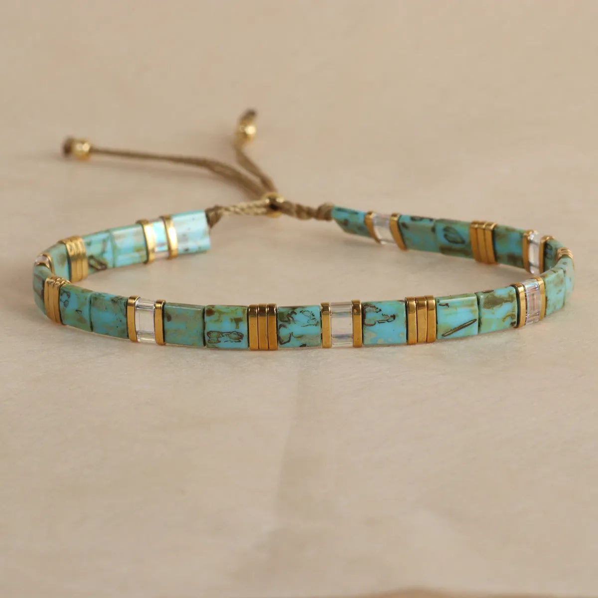 Glass and coloured glaze beaded bracelet with geometric round beads in five colour options