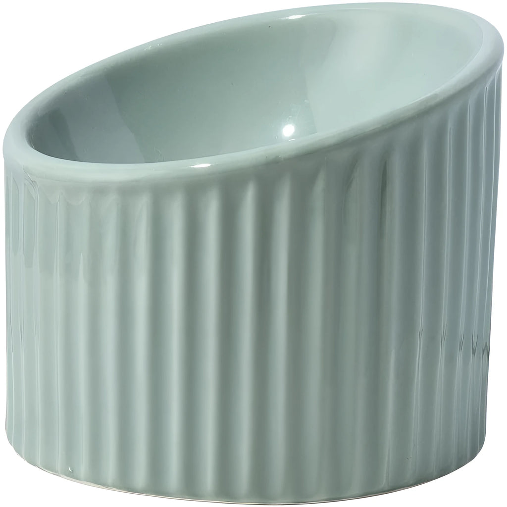 Ceramic elevated cat bowl in green, showing tilted round dish on a raised stand.