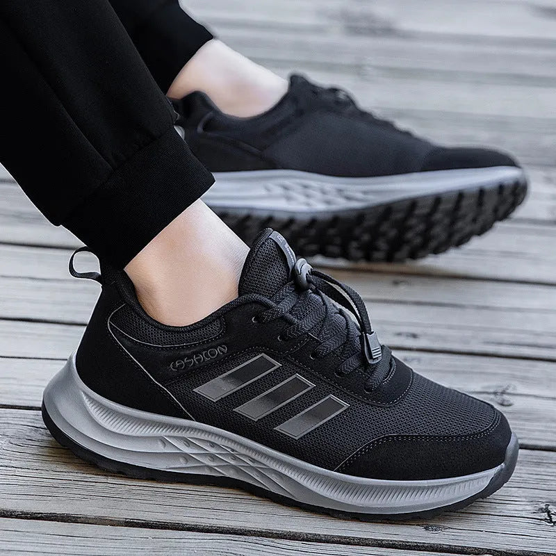 Casual unisex slip-on shoe with mesh upper and black elastic band fastening on a non-slip sole.