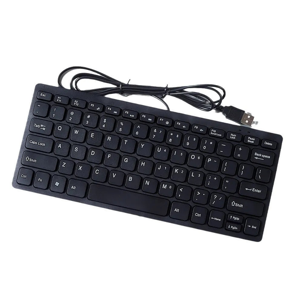 Compact USB wired keyboard in black, white, pink, or blue colour options on a desk.