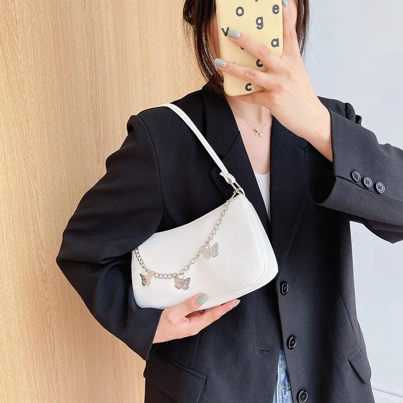 PU leather retro chain underarm bag in horizontal square shape showing crossbody strap and organised interior.
