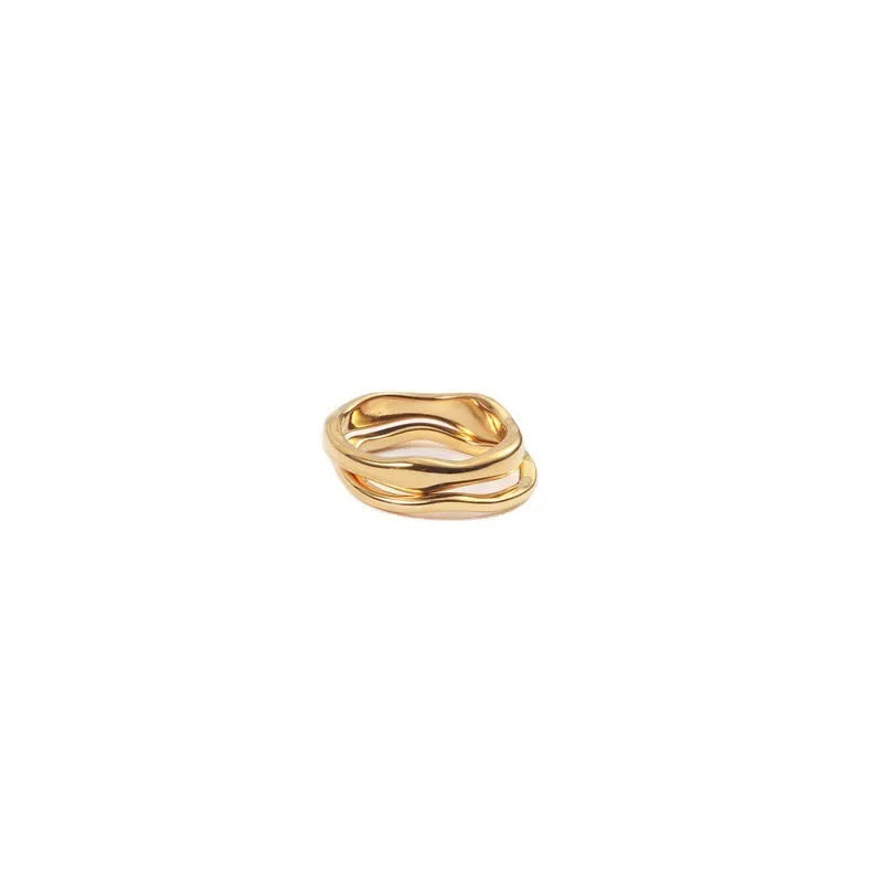 Women's stainless steel ring with wavy geometric design, 18K gold plated, in golden colour, on finger