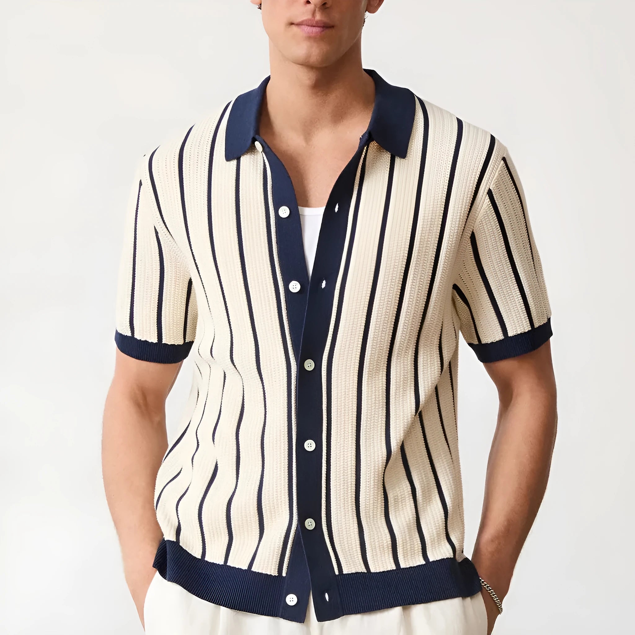 Men's white short sleeve knitted t-shirt with a lapel and asymmetric design detail.