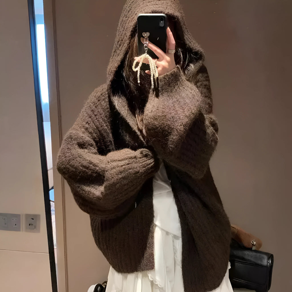 Women's dark grey retro Maillard knit hooded cardigan on a hanger, showing loose fit and regular sleeves.
