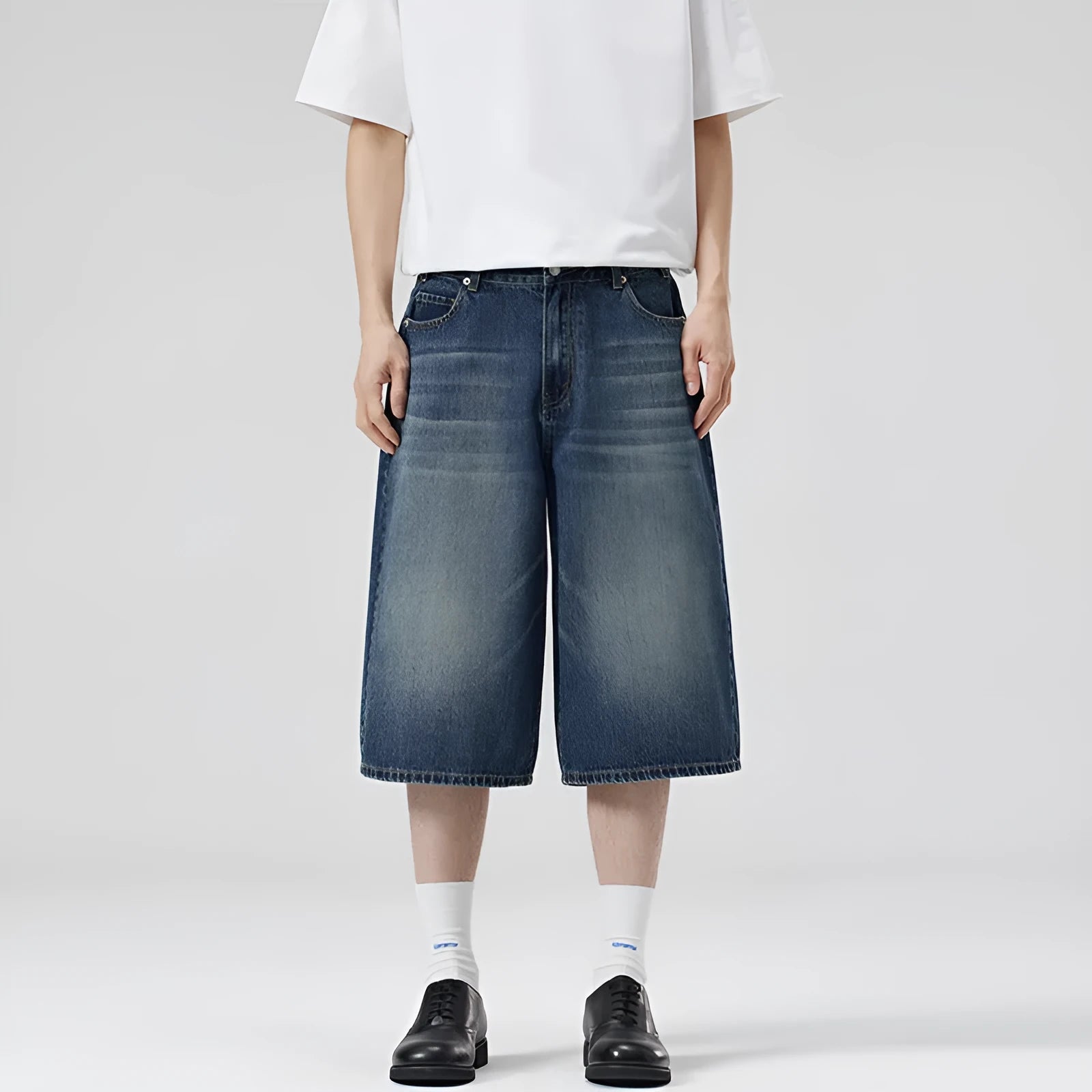 Men's loose straight-leg denim shorts in light blue on a model for summer
