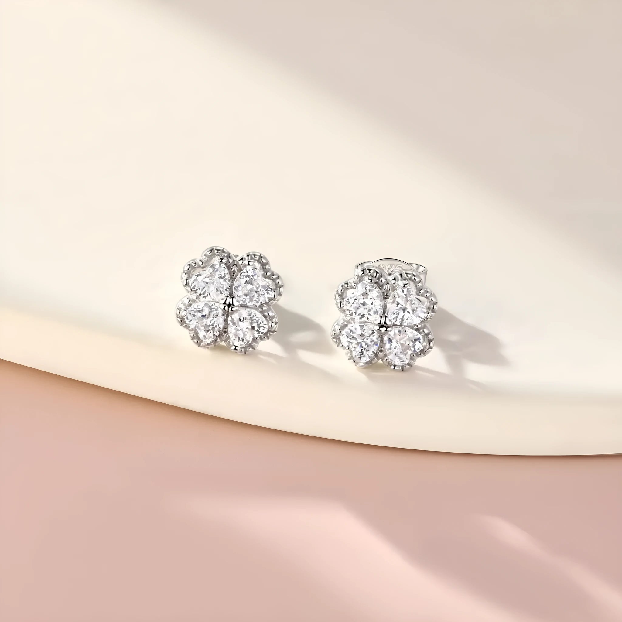 Zeng Yin white gold colour heart-shaped earrings with four-leaf clover design and zircon stones